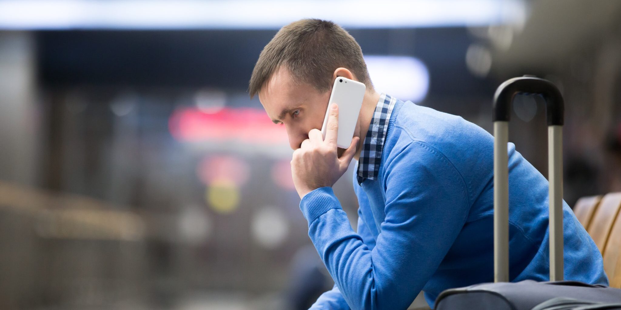 Young man on phone at airport