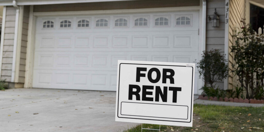 House with yard sign for rent