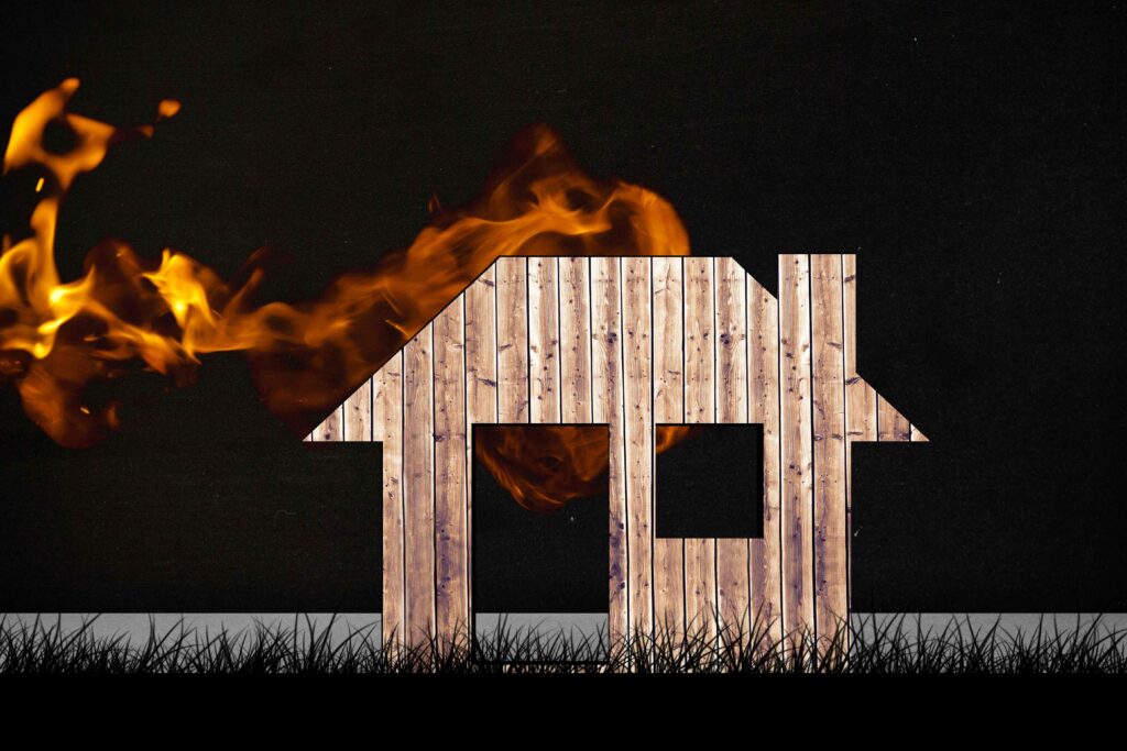 Wooden house with fire and smoke